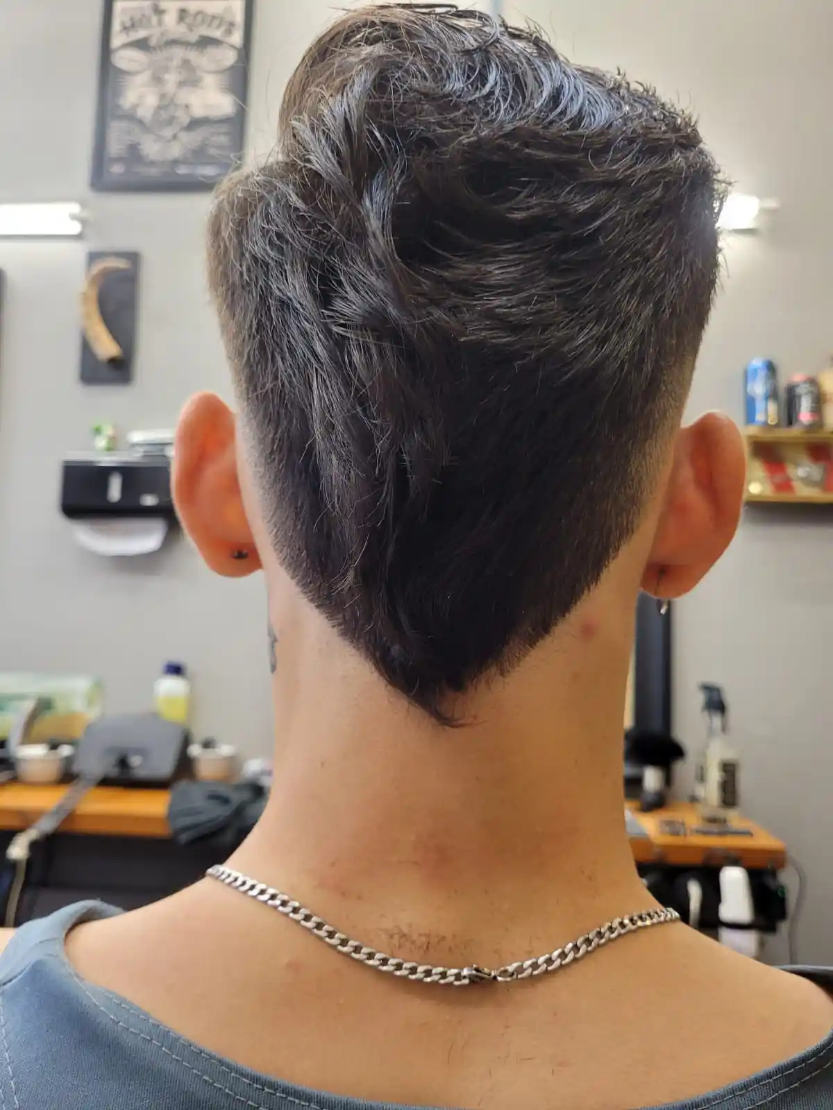 Nuca com degradê finalizado, mostrando o acabamento do corte.